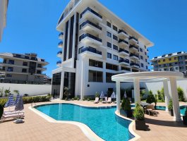 Новая квартира 1+1 с видом на море в современном ЖК, всего в 100 м от пляжа. Район Каргыджак