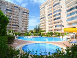 Квартира 2+1 с видом на море, в 500 м от пляжа в ЖК с обширной инфраструктурой. Район Махмутлар