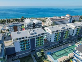 Квартира 1+1 с панорамным видом на горы в элитном ЖК в 150 м от пляжа. Район Каргыджак