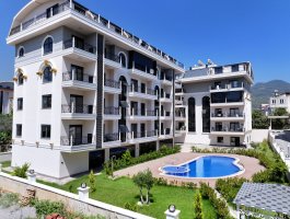 Новая квартира 1+1 в современном ЖК, в открытом для ВНЖ районе - Оба