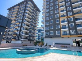 Новая квартира 1+1 в современном ЖК в районе Махмутлар