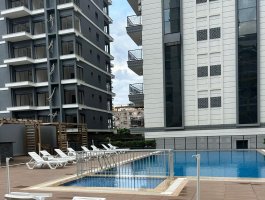 Новая квартира 1+1 в современном ЖК с обширной инфраструктурой. Район Махмутлар