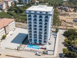 Квартира 1+1 с видом на горы, в современном ЖК. Район Махмутлар