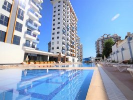 Новая квартира 1+1 с видом на море и горы, в ЖК с отельной инфраструктурой. Район Махмутлар