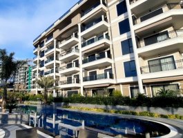 Квартира 1+1 с панорамным видом на море в элитном жилом комплексе у моря. Каргыджак