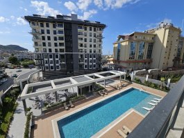 Квартира 1+1 в новом элитном ЖК в центре Аланьи. Район открыт для ВНЖ