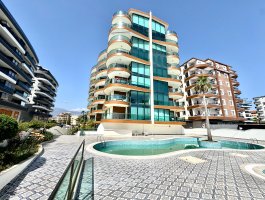 Квартира 1+1 с видом на море в элитном ЖК на первой береговой линии, в открытом для ВНЖ районе - Оба