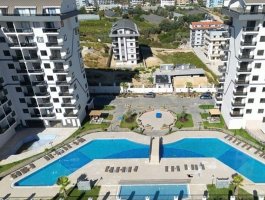 Новая квартира 1+1 в ЖК с отельной инфраструктурой в Паялларе. Район открыт для ВНЖ