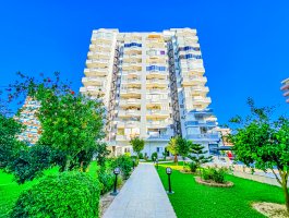 Дуплекс 4+1 с большой террасой с видом на море и горы в Махмутларе